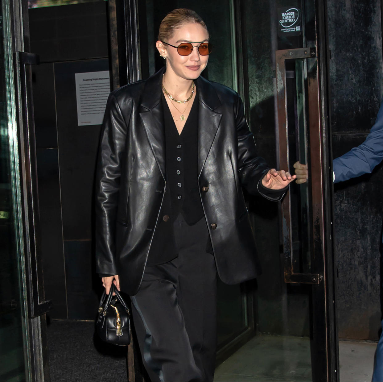  Gigi Hadid wears an all-black suit outfit in New York City. 