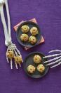 <p>These cheesy puff pastries, which only call for four ingredients, will be gone in the blink of an eye.</p><p><strong><em><a href="https://www.womansday.com/food-recipes/recipes/a60165/bitesize-eyeballs-recipe/" rel="nofollow noopener" target="_blank" data-ylk="slk:Get the Bite-Size Eyeballs recipe.;elm:context_link;itc:0;sec:content-canvas" class="link ">Get the Bite-Size Eyeballs recipe. </a></em></strong></p>