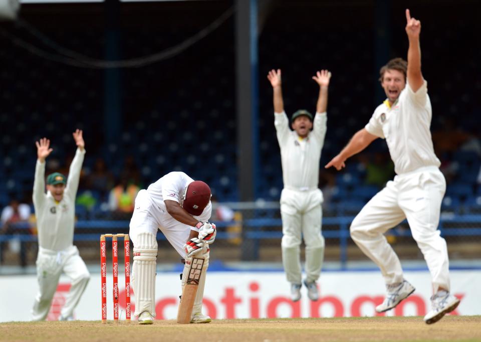 West Indies Kieran Powell (C) is LBW as Australian bowler Ben Hilfenhaus (R) and teammates appeal during the final day of the second-of-three Test matches between Australia and West Indies April19, 2012 at Queen's Park Oval in Port of Spain, Trinidad.