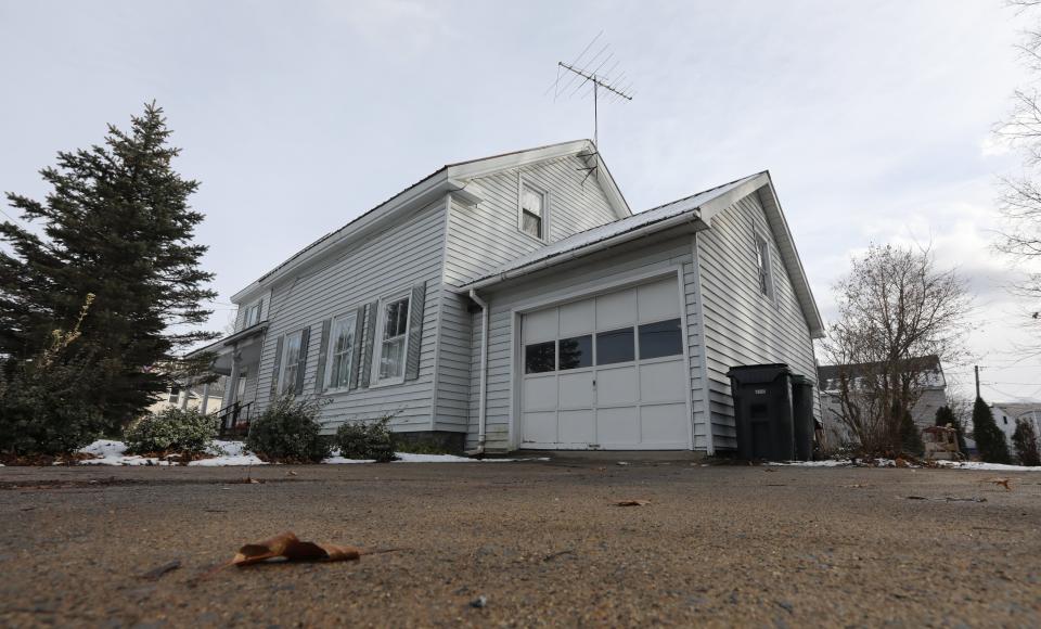 The house where Karen Mason's car crashed into the garage in Glens Falls is shown on Dec. 1, 2021.