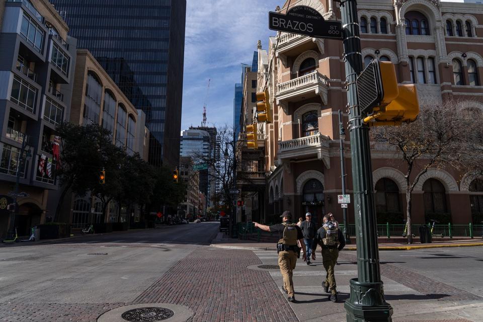 Brazos Street, shown at its intersection with Sixth Street, is one of several downtown streets named after Texas rivers. The Brazos River draws its name from the Spanish phrase “Los Brazos de Dios” or “the arms of God.”