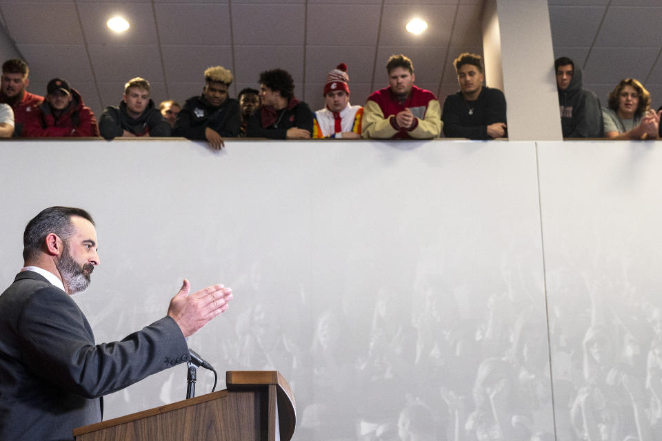 New Washington State football coach Nick Rolovich speaks during a press conference as players from the team look on from a balcony Thursday, Jan. 16, 2020, in Pullman, Wash. (Pete Caster/Lewiston Tribune via AP)