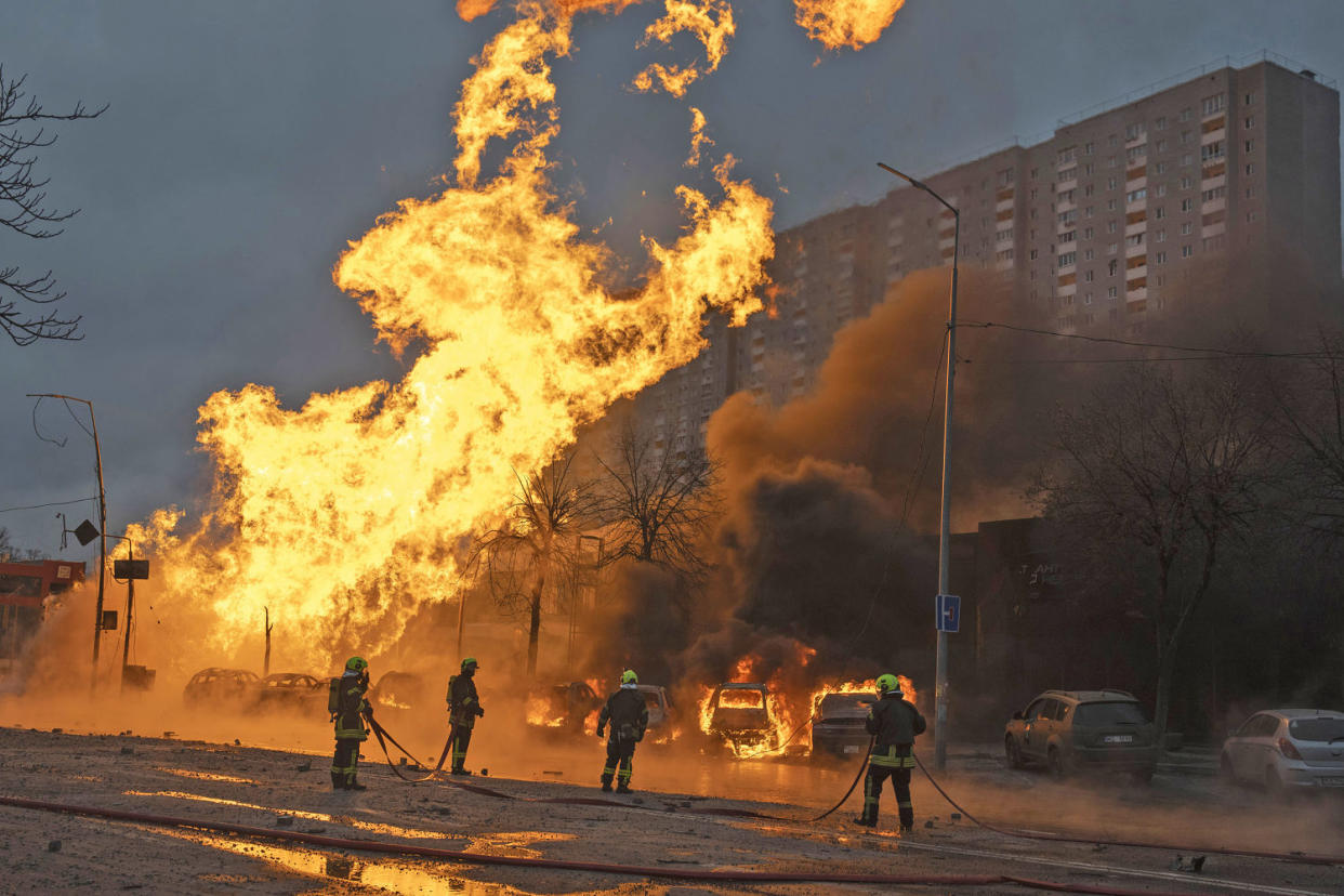 Firefighters work to extinguish a fire after a Russian attack in Kyiv, Ukraine, Tuesday, Jan. 2, 2024.  (Efrem Lukatsky / AP)