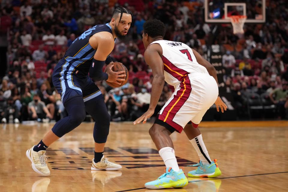 Dec 6, 2021; Miami, Florida, USA; Memphis Grizzlies guard Tyus Jones (21) dribbles the ball around Miami Heat guard Kyle Lowry (7) during the first half at FTX Arena. Mandatory Credit: Jasen Vinlove-USA TODAY Sports