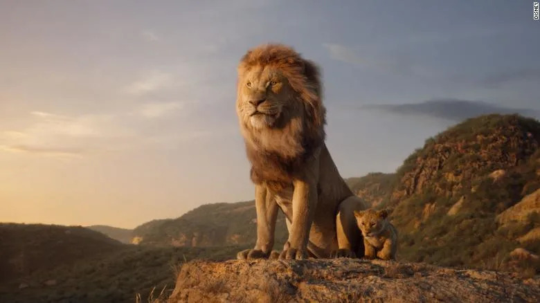 Mufasa stands on the top of Pride Rock alongside Simba as a cub.