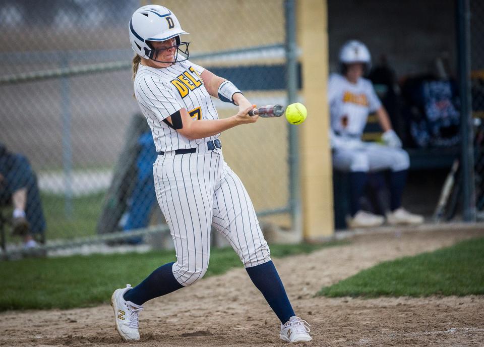 Delta's Sydney Stroble connects with a pitch from Northeastern during their game at Delta High School Tuesday April 12, 2022. 