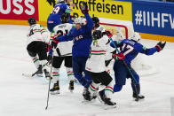 United States Nick Bonino, centre, celebrates after scoring his side's third goal during the group A match between United States and Hungary at the ice hockey world championship in Tampere, Finland, Sunday, May 14, 2023. (AP Photo/Pavel Golovkin)