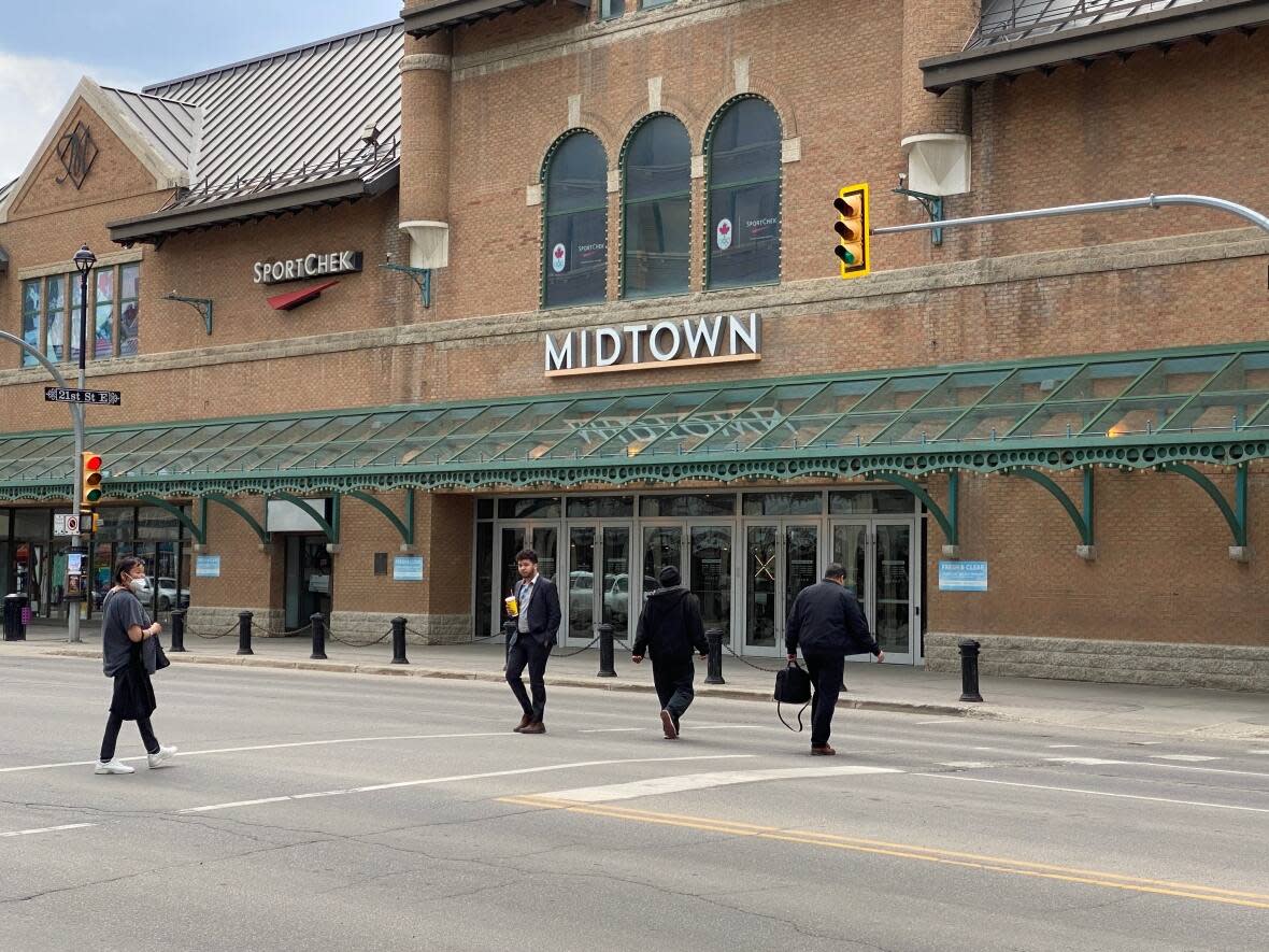 Arbutus Properties has indefinitely delayed a grocery store it was planning to build in downtown Saskatoon's Midtown Plaza after city council rejected the developer's request to start work on a Rosewood affordable housing complex before finishing sewer upgrades. (Travis Reddaway/CBC - image credit)