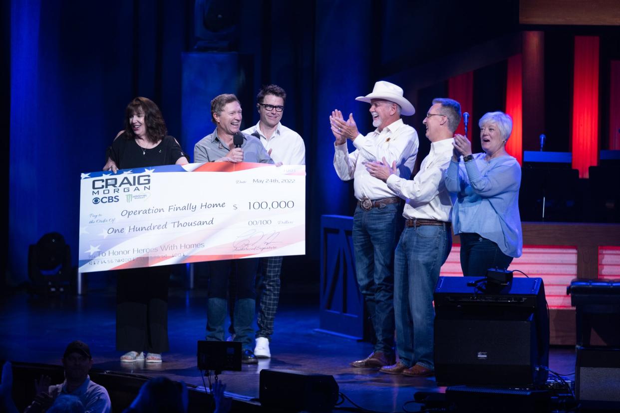 Pictured, from left, Darlene Barrett (Monster Energy), Craig Morgan, Bobby Bones, and Operation Finally Home’s Dan Wallrath, Rusty Carroll, and Molly Halliday.