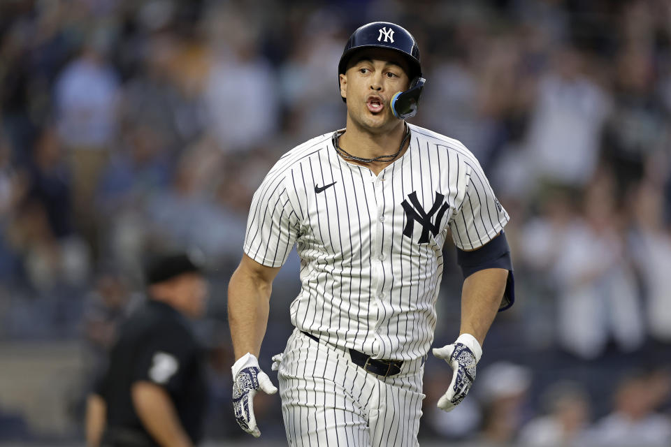 New York Yankees designated hitter Giancarlo Stanton reacts after hitting a home run against the Houston Astros during the third inning of a baseball game Wednesday, May 8, 2024, in New York. (AP Photo/Adam Hunger)