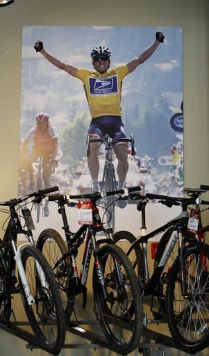 A poster of cyclist Lance Armstrong adorns a wall at Mellow Johnny's bike shop, pictured on October 18, in Austin, Texas. Armstrong on Friday shook off the cloud of doping allegations dogging him as he urged backers of his Livestrong charity to continue the fight against cancer