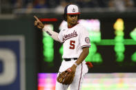 Washington Nationals shortstop CJ Abrams gestures during the fourth inning of the team's baseball game against the Chicago Cubs, Monday, Aug. 15, 2022, in Washington. (AP Photo/Nick Wass)