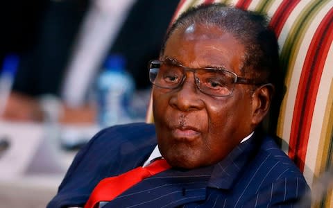 Robert Mugabe used his first interviews since being ousted from power to attack his former ally's 'undemocratic' takeover - Credit: PHILL MAGAKOE/AFP