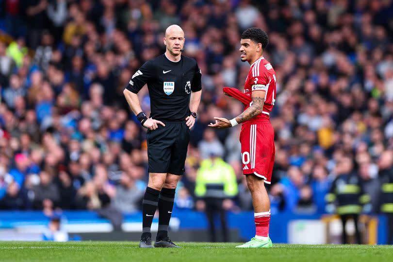 Morgan Gibbs-White protests to referee Anthony Taylor