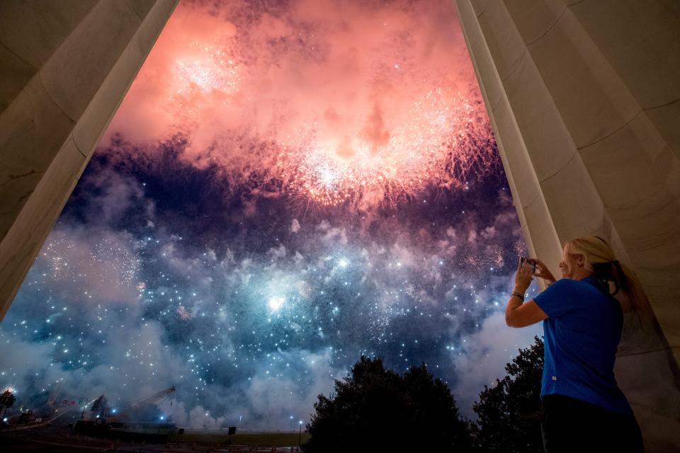 Fireworks are seen over the Potomac River from the Lincoln Memorial in Washington on July 4, 2019. President Donald Trump is moving ahead with a lower-key "Salute to America" celebration this year on July Fourth, despite concerns from some lawmakers about the crowds the event could generate during the coronavirus pandemic.