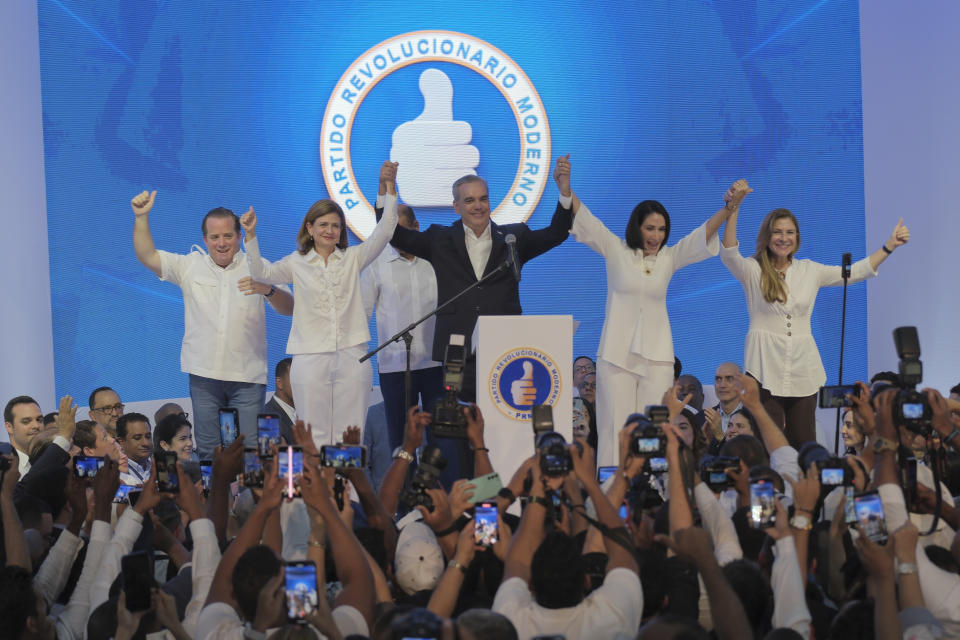 Incumbent presidential candidate Luis Abinader, center, addresses supporters after the first vote count showed him leading in general elections in Santo Domingo, Dominican Republic, Sunday, May 19, 2024. (AP Photo/Ricardo Hernandez)