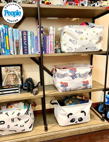 <p>Eryn Donaldson/The Model Home</p> Bookshelves reorganized to protect Gunner's treasured items while giving Ryker easy access to his own