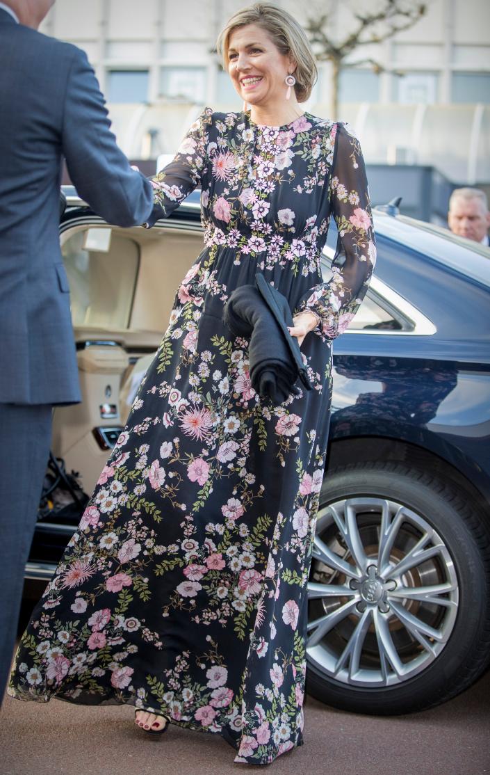 Queen Maxima of the Netherlands wears a long floral dress