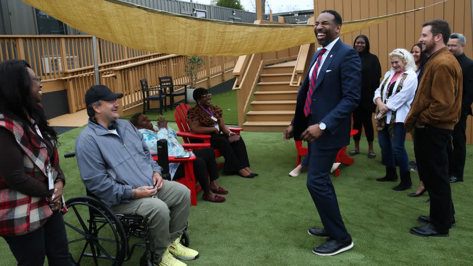 Atlanta Mayor Andre Dickens, right, speaks with residents and staff members at The Melody. - Austin Steele/CNN