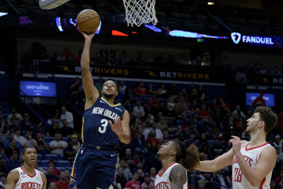 New Orleans Pelicans guard CJ McCollum (3) shoots against the Houston Rockets during the first half of an NBA basketball game in New Orleans, Wednesday, Jan. 4, 2023. (AP Photo/Matthew Hinton)