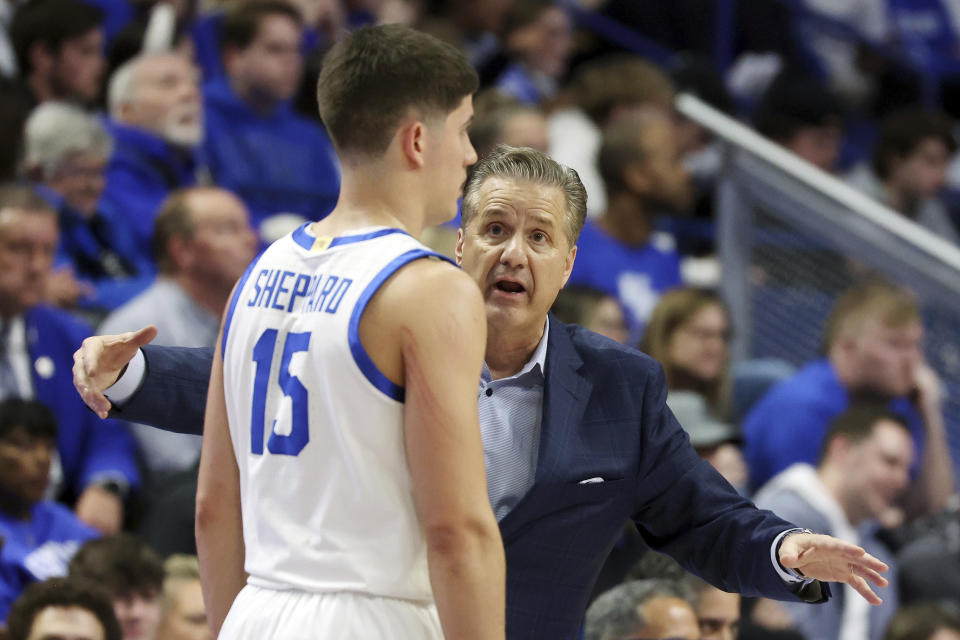 Kentucky head coach John Calipari, right, instructs Reed Sheppard (15) during the second half of an NCAA college basketball game against Mississippi Tuesday, Feb. 13, 2024, in Lexington, Ky. Kentucky won 75-63. (AP Photo/James Crisp)