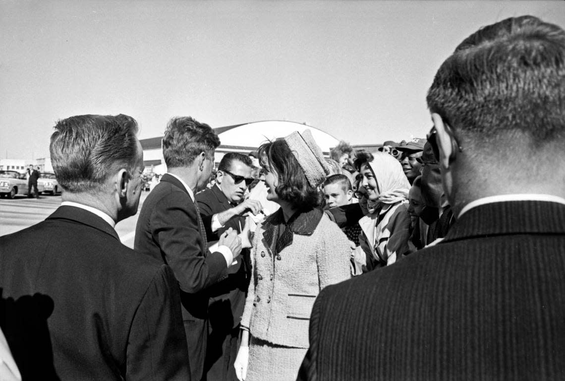 President John F. Kennedy signing autographs with Jackie Kennedy at Carswell Air Force Base in Fort Worth on the way to Dallas Love Field. Nov. 22, 1963
