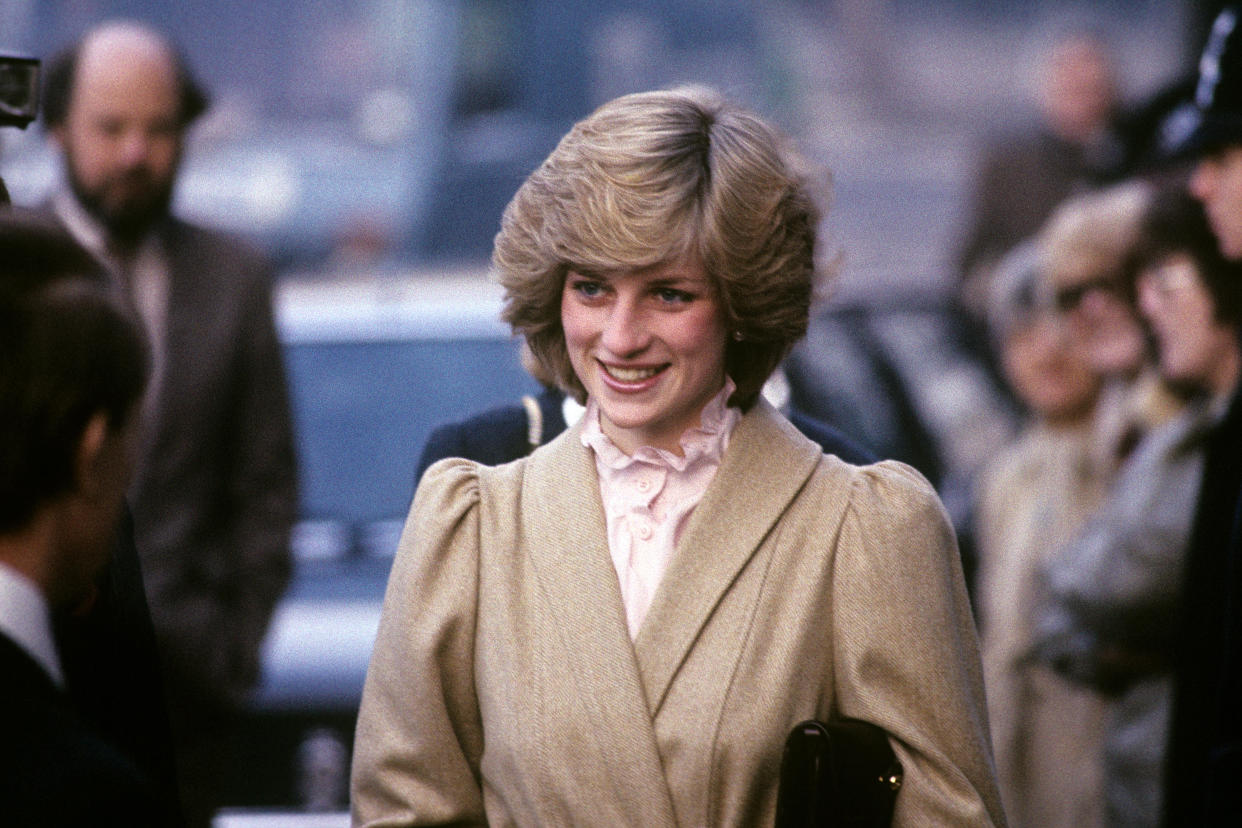 The Princess of Wales wore a ruffle neck blouse when she visited the Department of Health and Social Security in Elephant and Castle, London, on 3 December 1982.  (PA)