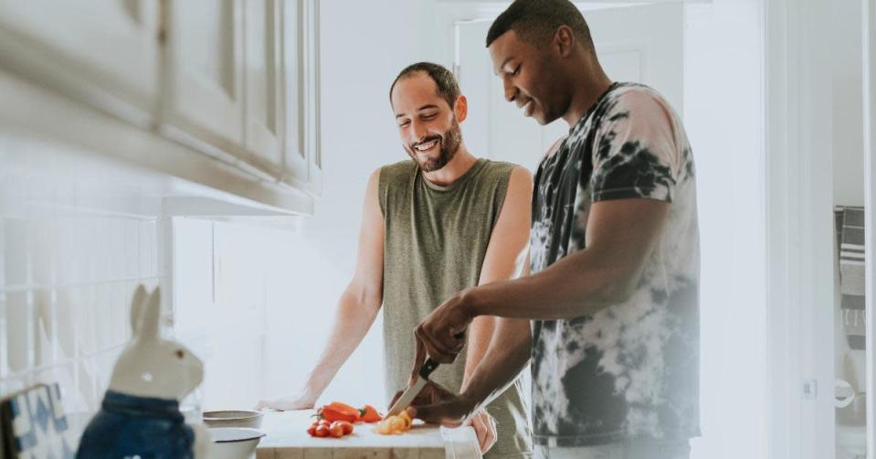 couple cooking in kitchen