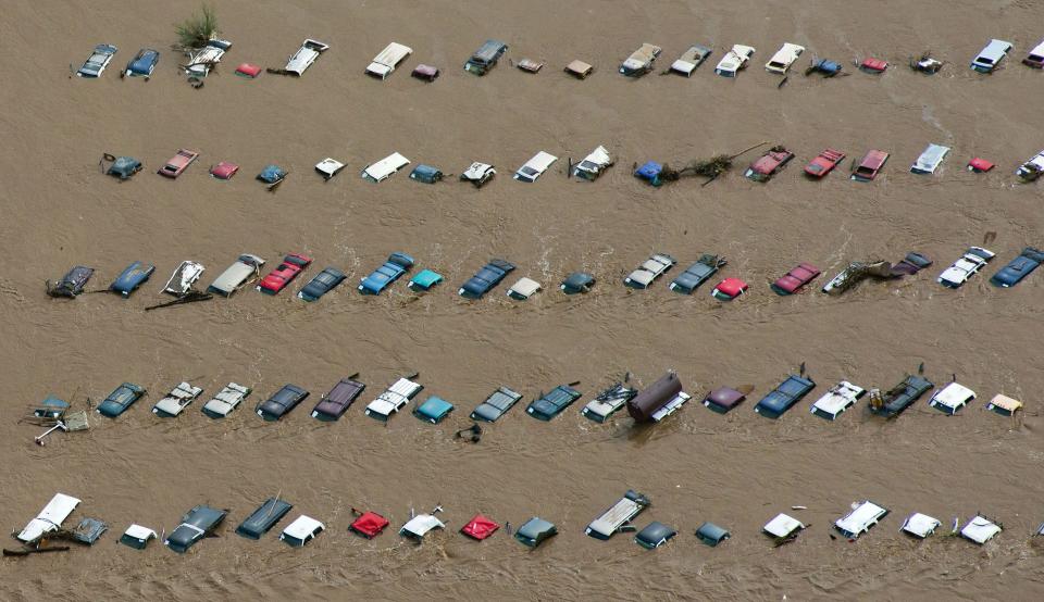 An aerial view of vehicles submerged in flood waters along the Sough Platte River near Greenley