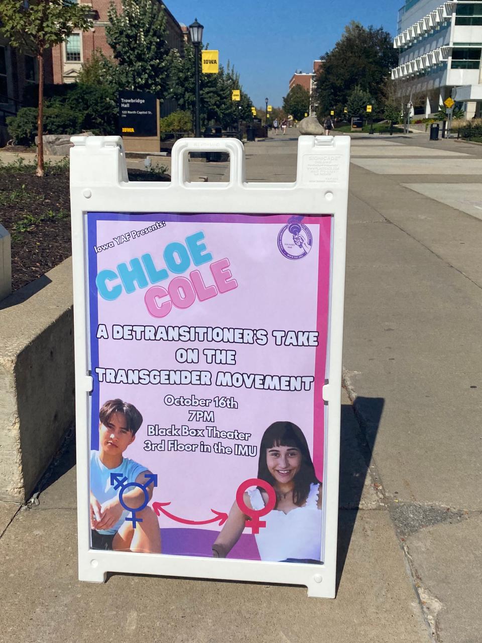 The A-Frame poster and sign for the Chloe Cole event, which the University of Iowa Young Americans for Freedom says was run over by students, who then stole the poster inside.