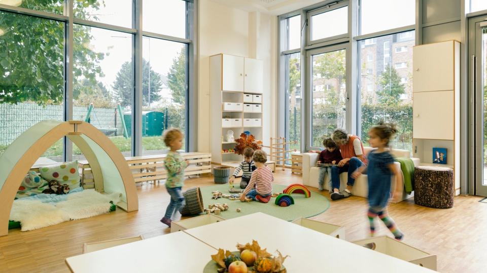 Children play in childcare centre. 