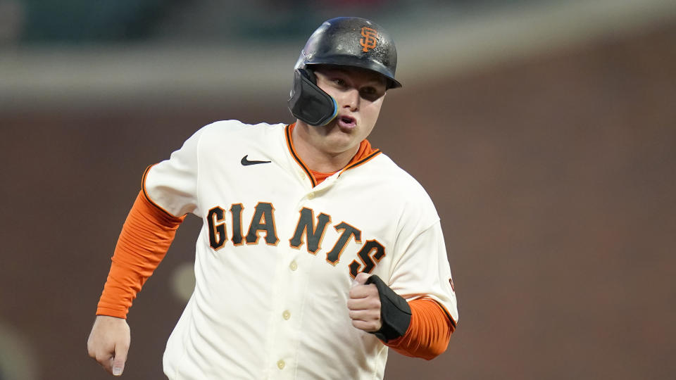 FILE - San Francisco Giants' Joc Pederson advances to third on a single by J.D. Davis during the first inning of a baseball game against the Colorado Rockies in San Francisco on Sept. 28, 2022. Outfielder Joc Pederson and left-hander Martín Pérez were the only players to accept $19.65 million qualifying offers from their former teams on Tuesday, Nov. 15, 2022. and end their free agency. Pederson decided to stay with the Giants and Pérez with the Texas Rangers. (AP Photo/Godofredo A. Vásquez, File)