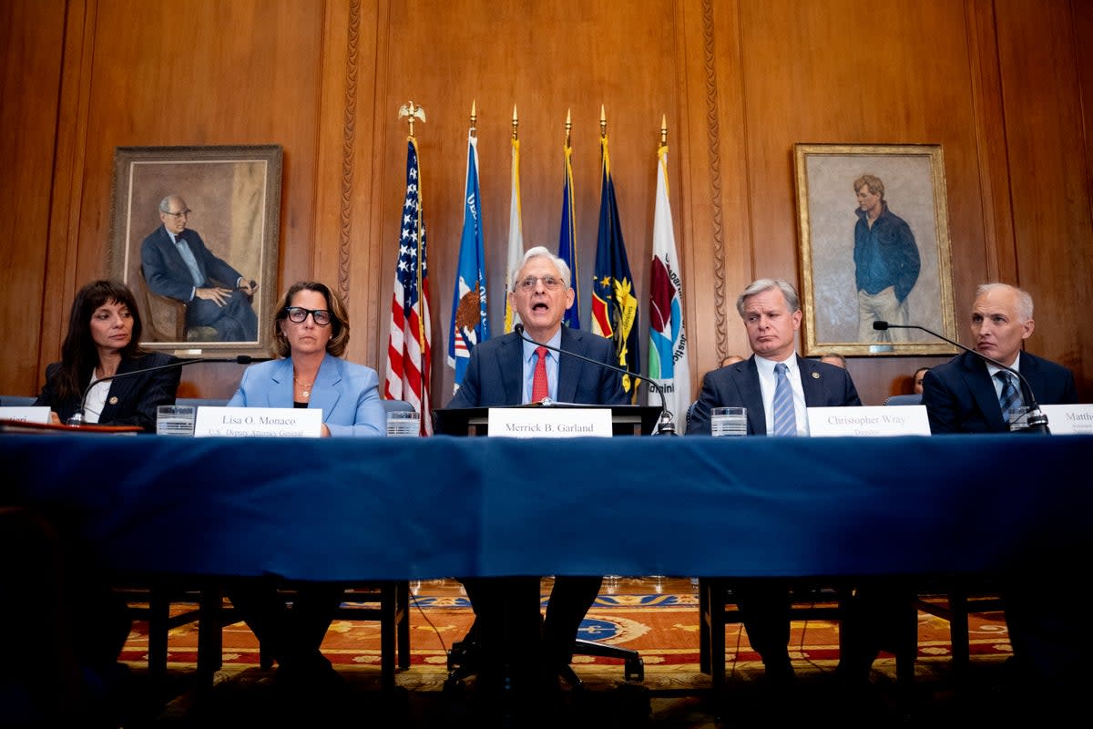 US attorney general Merrick Garland (C) accompanied from left, principal deputy assistant attorney general Nicole Argentieri, head of the Justice Department’s Criminal Division, deputy attorney general Lisa Monaco, FBI director Christopher Wray, and US assistant attorney general for the National Security Division Matt Olsen, speaks during an Election Threats Task Force meeting at the Justice Department on 4 September 2024 (Getty Images)