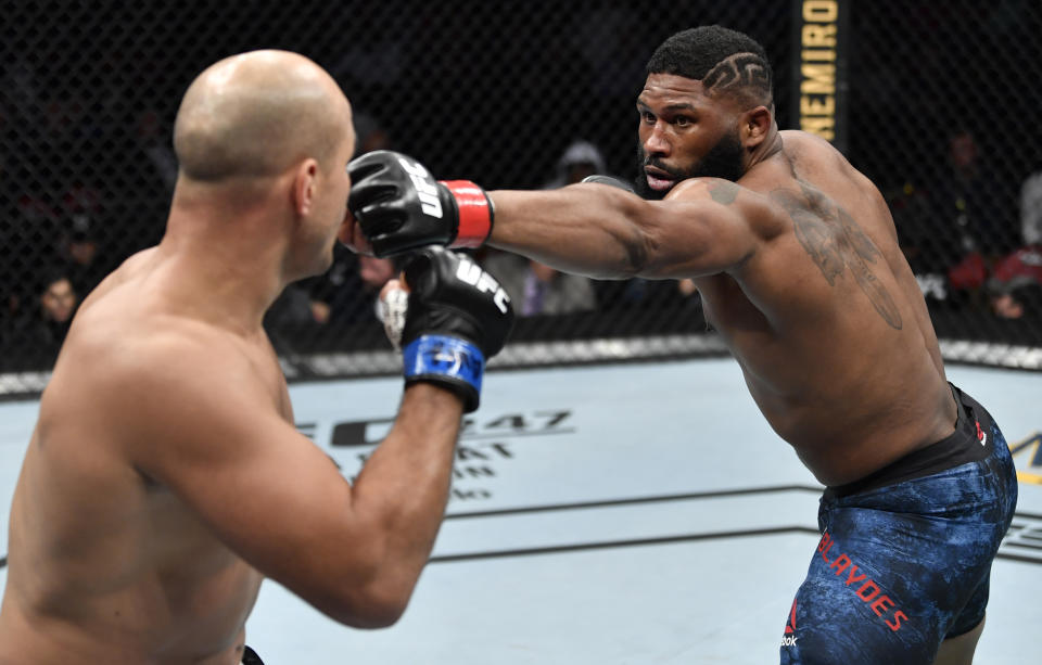 RALEIGH, NORTH CAROLINA - JANUARY 25:  (R-L) Curtis Blaydes punches Junior Dos Santos of Brazil in their heavyweight fight during the UFC Fight Night event at PNC Arena on January 25, 2020 in Raleigh, North Carolina. (Photo by Jeff Bottari/Zuffa LLC via Getty Images)