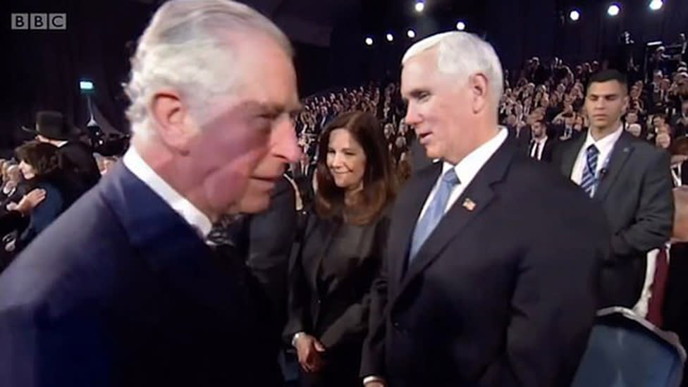 Prince Charles (left) passes vice president Mike Pence and wife Karen Pence at Yad Vashem