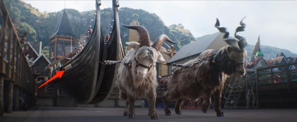 A red arrow pointing to a boat pulled by goats in "Thor: Love and Thunder."