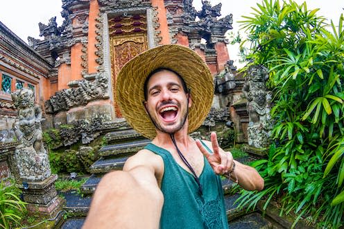   <span class="attribution"><a class="link " href="https://www.shutterstock.com/image-photo/happy-man-taking-selfie-selfportrait-bali-1908620083" rel="nofollow noopener" target="_blank" data-ylk="slk:DavideAngelini/Shutterstock;elm:context_link;itc:0;sec:content-canvas">DavideAngelini/Shutterstock</a></span>