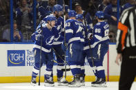 Tampa Bay Lightning center Brayden Point (21) celebrates with teammates, including defenseman Darren Raddysh (43) and right wing Nikita Kucherov (86), after scoring against the Ottawa Senators during the first period of an NHL hockey game Thursday, April 11, 2024, in Tampa, Fla. (AP Photo/Chris O'Meara)