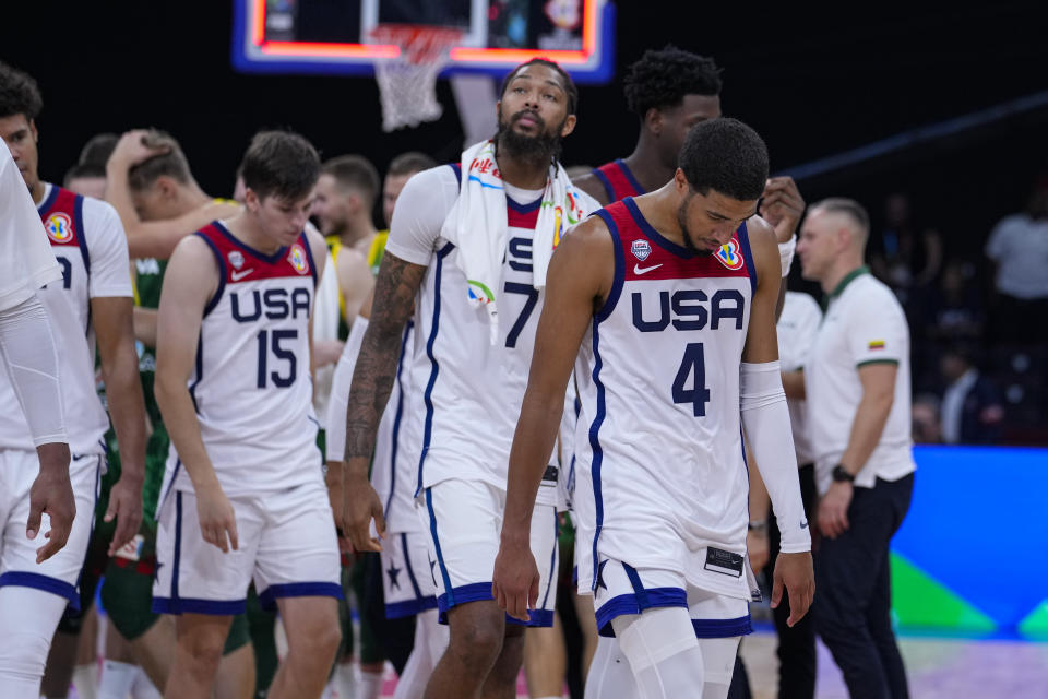 U.S. guard Tyrese Haliburton (4) leads the team off the court after a loss to Lithuania in a Basketball World Cup second-round match in Manila, Philippines Sunday, Sept. 3, 2023.(AP Photo/Michael Conroy)