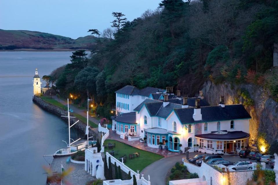 <p>Perched on its own peninsula and quite unlike anywhere else in the world, this visionary and even eccentric spot – familiar to many as the location for the cult 1960s TV series The Prisoner – embraces a spa, shops, restaurants, café and a gelateria, all tucked within subtropical woodland gardens with estuary views. </p><p>Classic and contemporary accommodation is divided between the Grade II listed <a href="https://www.booking.com/hotel/gb/the-portmeirion-castell-deudraeth.en-gb.html?aid=2070935&label=best-wales-hotels" rel="nofollow noopener" target="_blank" data-ylk="slk:Hotel Portmeirion;elm:context_link;itc:0" class="link ">Hotel Portmeirion</a>, an early-Victorian villa with an open-air swimming pool on the estuary lawn, and Castell Deudraeth, a Victorian castellated folly, or there are also rooms and suites dotted around the village itself, and 15 cottages.</p><p><a class="link " href="https://www.booking.com/hotel/gb/the-portmeirion-castell-deudraeth.en-gb.html?aid=2070935&label=best-wales-hotels" rel="nofollow noopener" target="_blank" data-ylk="slk:CHECK AVAILABILITY;elm:context_link;itc:0">CHECK AVAILABILITY</a></p>
