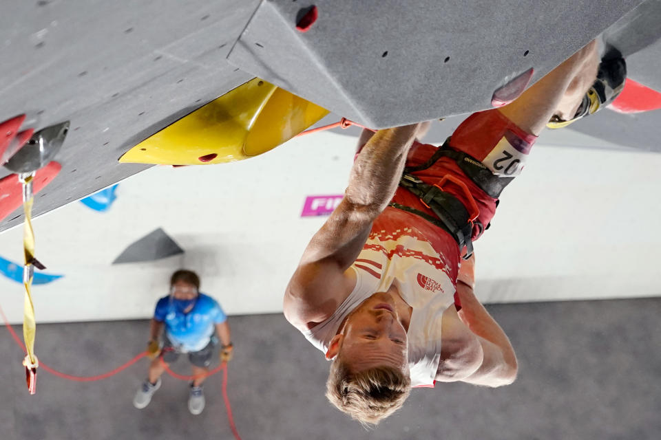 In this overview image Austria's Jakob Schubert approaches the top to win the men's sport climbing lead final during the Tokyo 2020 Olympic Games at the Aomi Urban Sports Park in Tokyo on August 5, 2021. (Photo by - / POOL / AFP) (Photo by -/POOL/AFP via Getty Images)