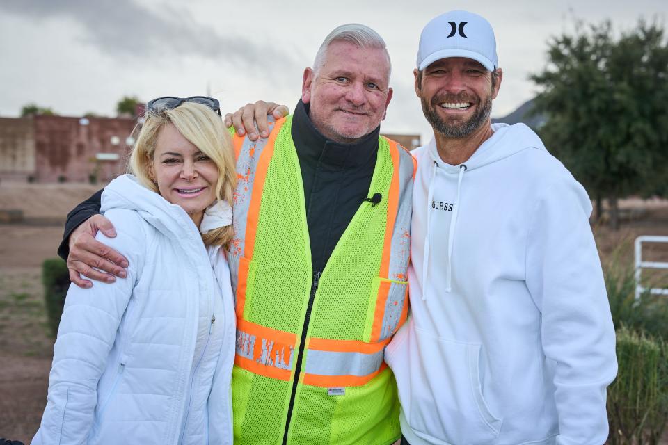 Left to right, Lisa Schneider, Walter Spano and Mark Schneider pose for a photo outside of Payne Junior High School in Queen Creek on Dec. 12, 2022.