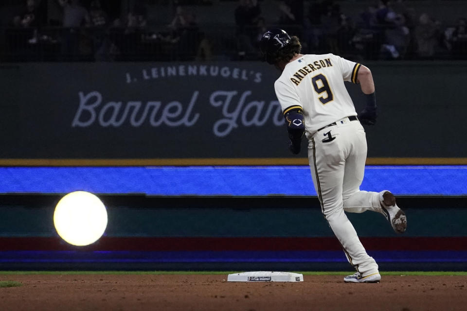 Milwaukee Brewers' Brian Anderson rounds second base after hitting a two-run home run during the fourth inning of a baseball game against the New York Mets Monday, April 3, 2023, in Milwaukee. (AP Photo/Aaron Gash)