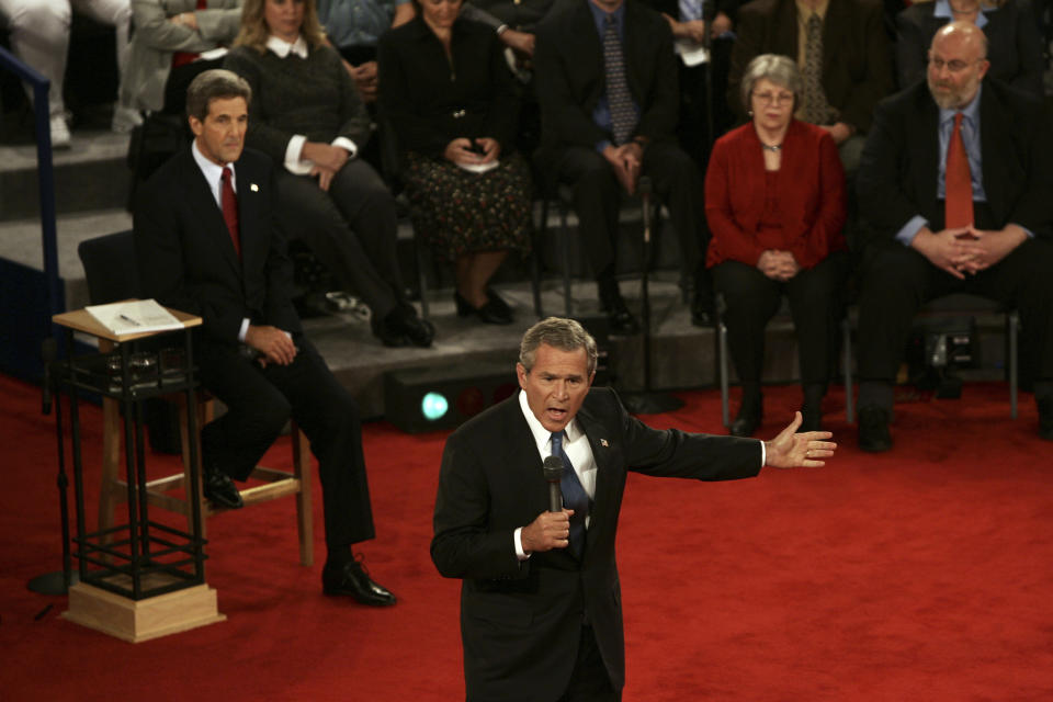 FILE - President Bush and Democratic Presidential candidate Sen. John Kerry, D-Mass., participate in the second Presidential debates at Washington University in Saint Louis, Mo., Friday, Oct. 8, 2004. President Joe Biden is trying to focus the campaign on former President Donald Trump's comments and policy proposals, sometimes more than his own. It's a time-worn strategy of White House incumbents to try to negatively define their rivals in the public's eyes. In 2004, President George W. Bush did to Democratic nominee John Kerry, who was a Massachusetts senator. (AP Photo/Gerald Herbert, File)