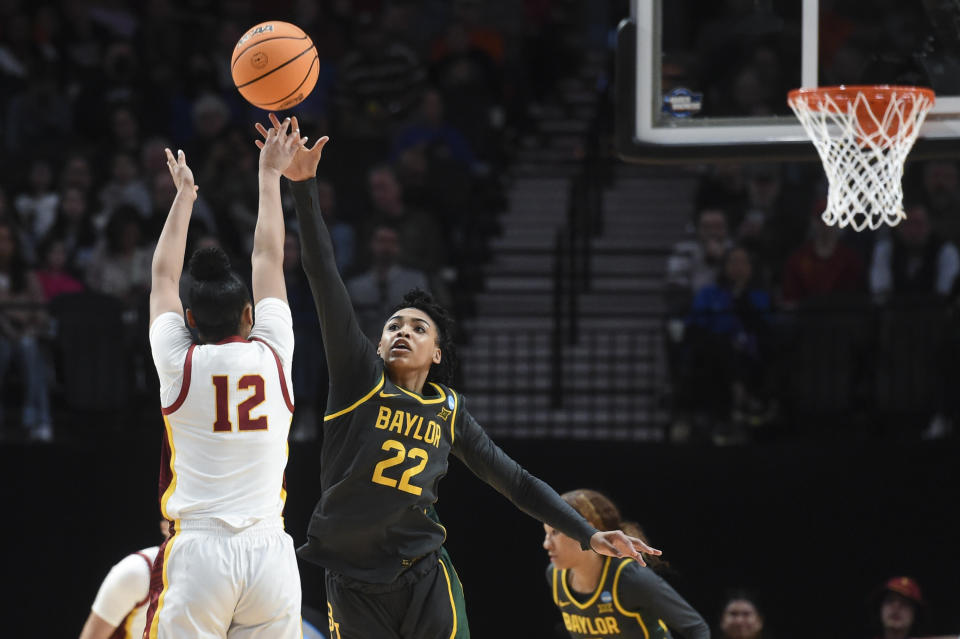 Southern California guard JuJu Watkins (12) shoots as Baylor guard Bella Fontleroy (22) defends during the second half of a Sweet 16 college basketball game in the NCAA Tournament, Saturday, March 30, 2024, in Portland, Ore. (AP Photo/Steve Dykes)