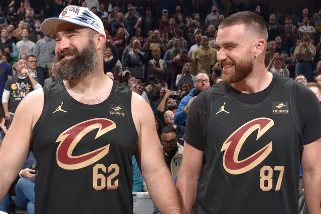 <p>David Liam Kyle/NBAE via Getty</p> Jason Kelce and Travis Kelce attend Cleveland Cavaliers game