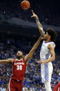 Kentucky's Nick Richards, right, shoots over Alabama's Galin Smith (30) during the first half of an NCAA college basketball game in Lexington, Ky., Saturday, Jan 11, 2020. (AP Photo/James Crisp)