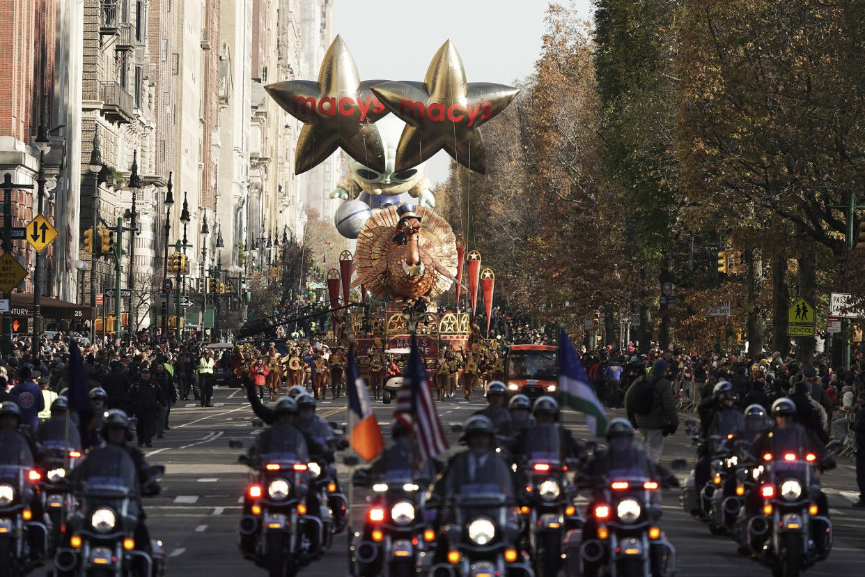 The Tom Turkey float leads the way down Central Park West on Thursday.  (Jeenah Moon / AP)