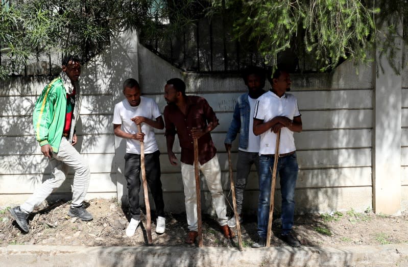 Oromo youth stand guard outside Jawar Mohammed's house, an Oromo activist and leader of the Oromo protest in Addis Ababa