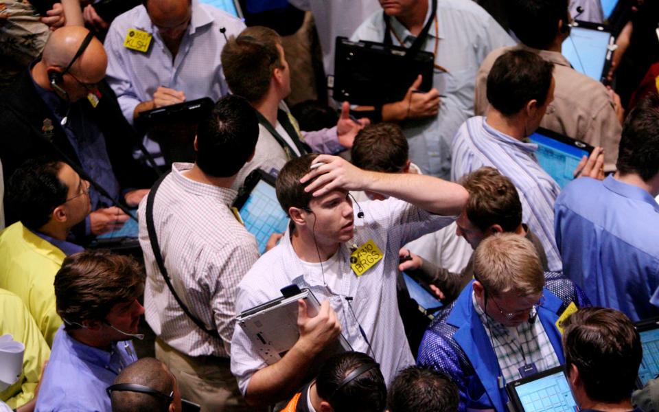 FILE- In this Sept. 15, 2008, file photo traders work in the product options pit at the New York Mercantile Exchange in New York. A decade ago, as Lehman Brothers went bust and the fragile financial system was teetering, fund investors wondered how bad it could get. The S&P 500 plunged 4.6 percent on Sept. 15, 2008 and would incur worse losses in the ensuing months. (AP Photo/Seth Wenig, File) - AP Photo/Seth Wenig